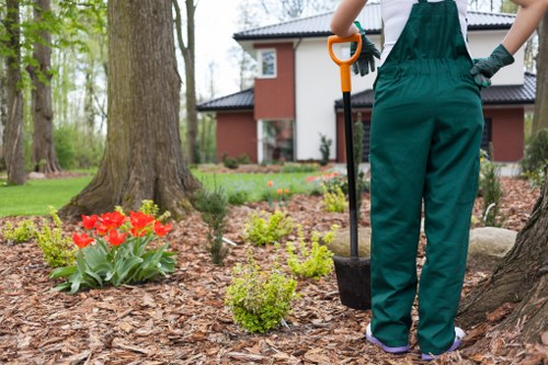 First aid kit and safety signage at a garden maintenance site
